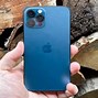 Image result for Black Hand Holding iPhone 13 Pro Max