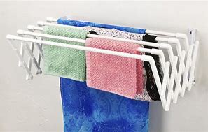 Image result for Wall Mounted Fold Away Clothes Rack