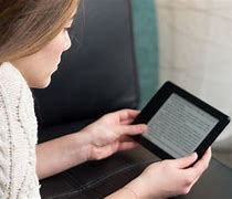 Image result for Happy Woman Reading Kindle