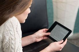 Image result for Woman Reading Kindle