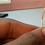 Image result for A Man Trying to Fix Headphone Jack