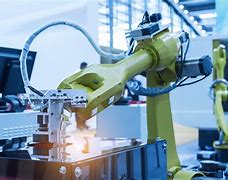 Image result for Robot Working in the Light Out Factory