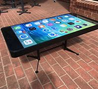 Image result for Table Made with Mobile Phones Under Glass