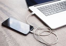 Image result for Cell Phone Plugged in Government Computer