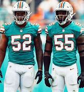 Image result for NFL Player Flexing Miami Dolphins