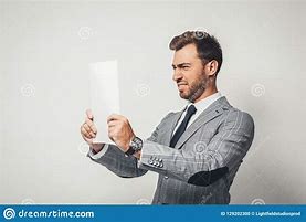 Image result for Man Standing Looking at Paper
