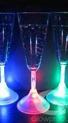 Image result for Light-Up Champagne Flutes Toasting