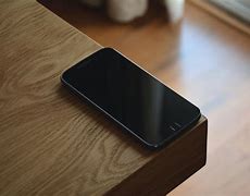 Image result for Table above Phone