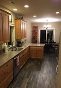 Image result for Vinyl Plank Flooring with Oak Cabinets
