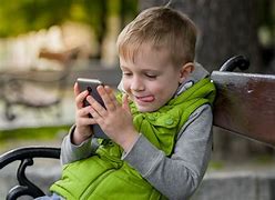 Image result for Kids Looking at Cell Phone