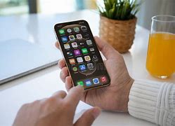 Image result for Person Holding iPhone 12 Pro Max