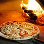 Image result for Cooking in a Pizza Wood-Burning Oven