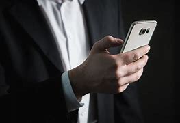 Image result for Business Person Using Cell Phone