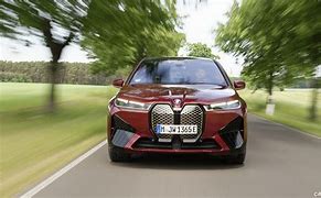 Image result for Aventurin Red BMW IX Front