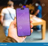 Image result for Person Holding iPhone 14 Stock Picture