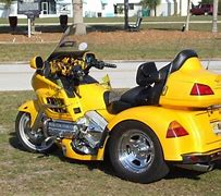 Image result for Motorcycle Scooter in Car