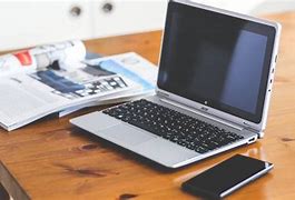 Image result for Laptop and Phone On Desk