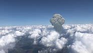 Large mushroom cloud explosion or volcano over Clouds