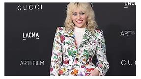 Miley Cyrus Wore a Dazzling Patterned Suit With A Matching Purse to the LACMA Gala