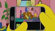 Homer Simpson eats an Apple iPhone