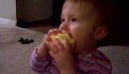 baby eating apple
