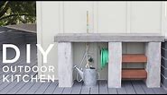 DIY Outdoor Kitchen with Concrete countertops and sink