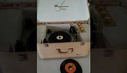Magnavox Stereo portable record player playing a few 45's