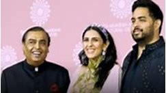 News18 - Mukesh Ambani Poses with son Akash Ambani and...