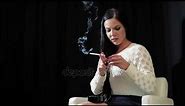 Watch lovely girl lighting up and smoking a 120mm Cigaronne.