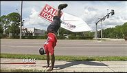 You've got to see this roadside sign-spinner