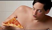 AI Tobey Maguire eating pizza