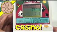 Casino 5 in 1 Electronic Handheld Game - Black Jack, Draw Poker, Baccarat, Deuces Wild, Slots