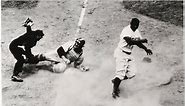 Jackie Robinson - Robinson stealing home in 1952.