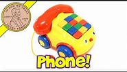 Megcos Pull-Along Rolling Musical Numbers Telephone Baby Toy