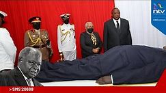 President Uhuru Kenyatta views Mwai Kibaki's body at Parliament