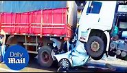 Motorist found ALIVE after being crushed between two trucks