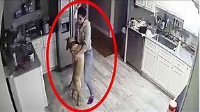 The camera recorded what this woman was doing with the dog when her husband was not at home