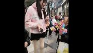 2.20 meters Asian super tall girl is on the street