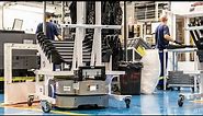 Operators and robots work in harmony: Grupo Antolin automates handling of car interior components