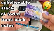 unbelievable stack of swiss 1000 CHF franc bank notes counting by money machine