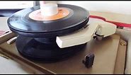 Automatic 45 Record changer playing a stack of 45 RPM records.