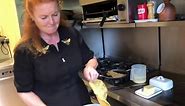 Sarah Ferguson attempts to flip a pancake