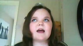 A girl is trying to sing I will always love you by Whitney Houston but keeps failing and gets angry