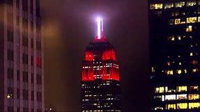 The Empire State Building lit up with red siren lights on Monday night.
