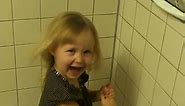 Lilly having a blast using a hand dryer