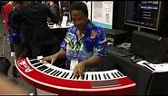 Kris Nicholson playing on the curved Piano Arc keyboard controller at NAMM 2019 very difficult