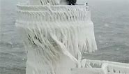 Winter Storm Covers Historic Lake Michigan Lighthouse In Ice