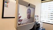 Remote-controlled robots roam the office for the ultimate in telecommuting