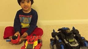 Kid playing with Remote control toys Batman Imaginext Batbot