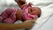 Newborn Baby girl getting dressed leaving hospital